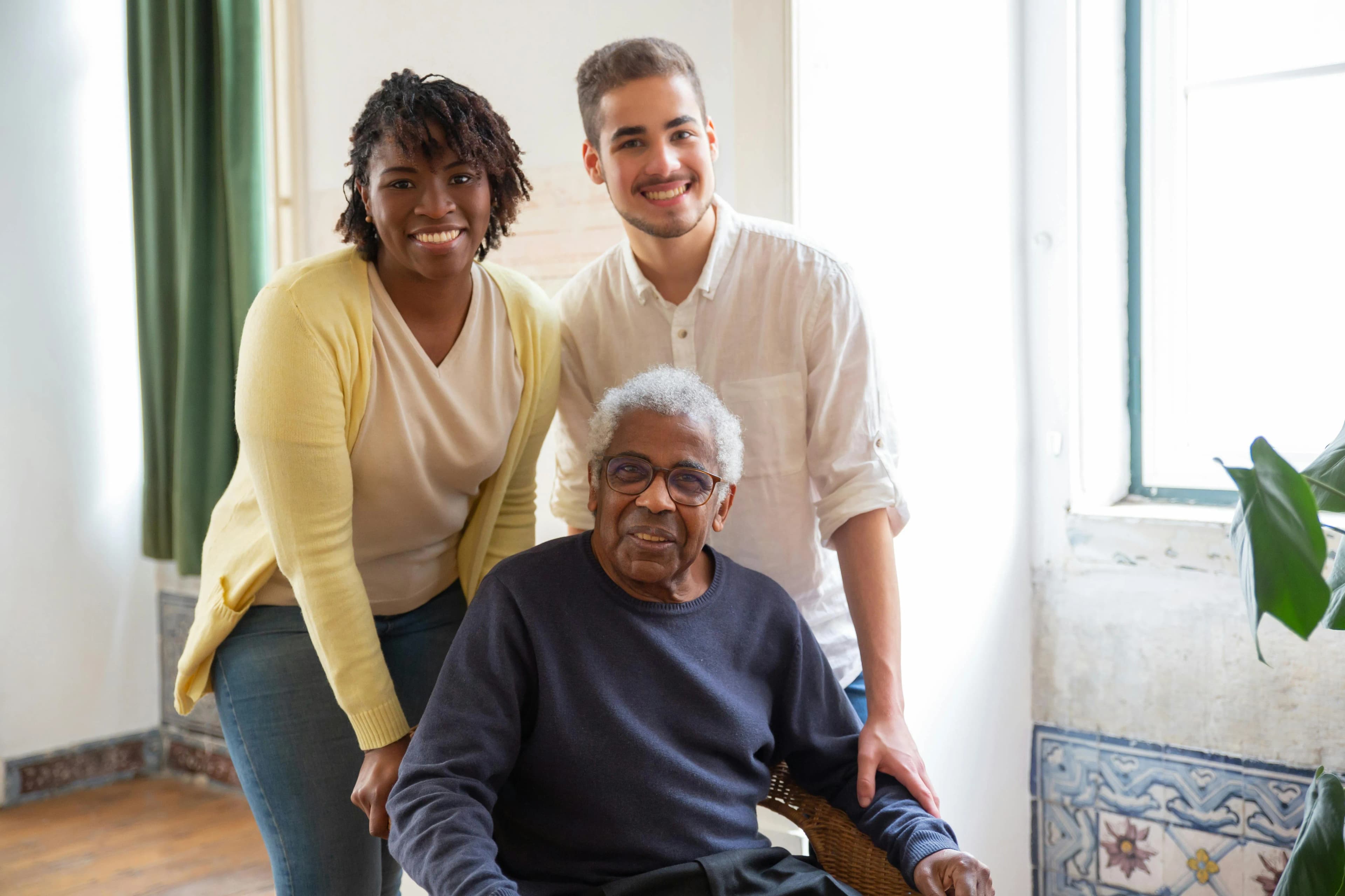 Multigenerational family smiling together in the comfort of home